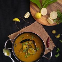 A picture of Tetor Dal (Bitter Gourd Yellow Mung Stew).