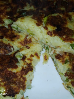 Una foto de Fainá de lechuga y queso