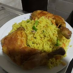 A picture of Fried rice with grilled chicken.