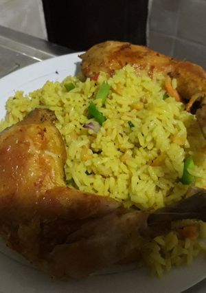 A picture of Fried rice with grilled chicken.