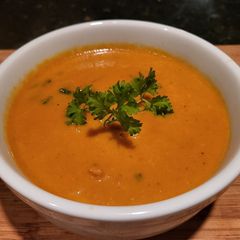 A picture of Creamy Thai Carrot Soup w/ Basil.