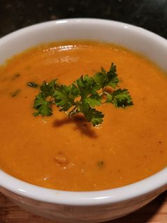 A picture of Creamy Thai Carrot Soup w/ Basil.