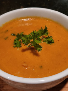 A picture of Creamy Thai Carrot Soup w/ Basil.