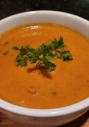 A picture of Creamy Thai Carrot Soup w/ Basil.
