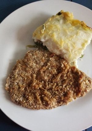Una foto de Milanesa al horno con pastel "Es, Pu, Sa."