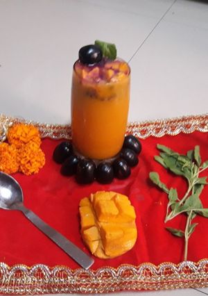 A picture of Mango mastani with black jamun.
