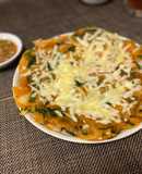 Bánh kếp Hàn Quốc (pajeon) với kim chi và thức ăn thừa