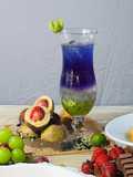 Candied nutmeg combined with lychee soda and butterfly pea flowers