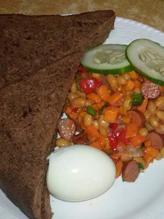 A picture of Chocolate bread with baked beans sauce, boiled egg & few slices of any veg of your choice.