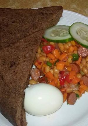 A picture of Chocolate bread with baked beans sauce, boiled egg & few slices of any veg of your choice.