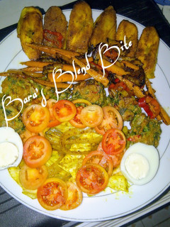 A picture of Indian green flour balls, grilled plantain curry rolled potatoes, glazed spicy carrots strips.