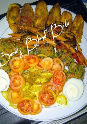 A picture of Indian green flour balls, grilled plantain curry rolled potatoes, glazed spicy carrots strips.