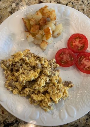 A picture of Scrambled Eggs with Sausage & Potatoes.