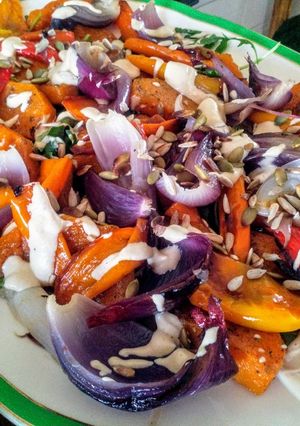 A picture of Autumn rainbow vegetable salad with tahini dressing.