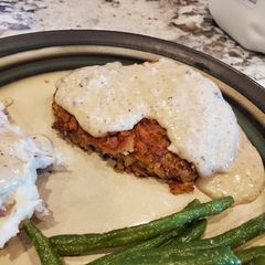 A picture of Classic Country Chicken Fried Steak with white gravy.