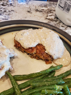 A picture of Classic Country Chicken Fried Steak with white gravy.