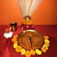 A picture of Durga puja special navmir bhog(Rui fish Kalia).