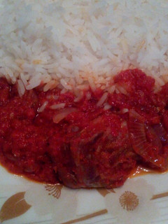 A picture of White rice and stew.