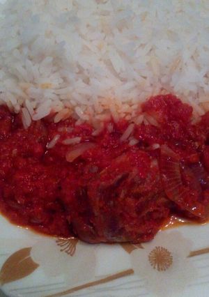 A picture of White rice and stew.