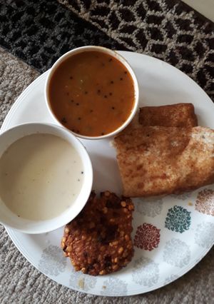A picture of Dal vada, dosa with chutney and sambhar.