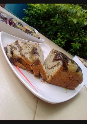 A picture of Chocolate x citrus banana swirl loaf with citrus glaze.