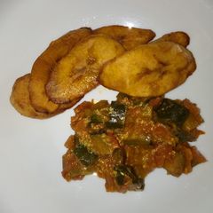 A picture of Breakfast leftover eggplants curry and plantain#Author marathon.