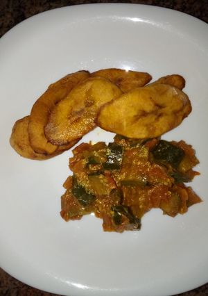 A picture of Breakfast leftover eggplants curry and plantain#Author marathon.