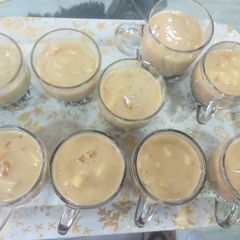 A picture of Fruit custard black curant jelly with strawberry sauce.