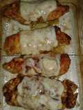 Rollos de pechuga rellenos de jamón y queso gratinados
