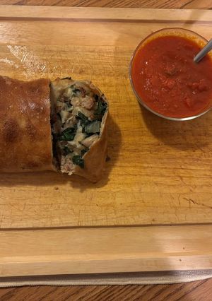 A picture of Sausage Stromboli with spinach, mushrooms & onions.