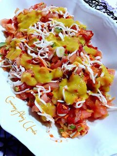 Una foto de Ensalada de tomates mixta con aderezo de mango