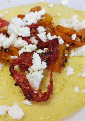 A picture of Roasted romano peppers, gratin breadcrumbs & feta open omelette.