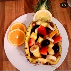 A picture of Pineapple bowl fruit salad.
