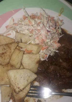 A picture of Yam with liver sauce and coleslaw.