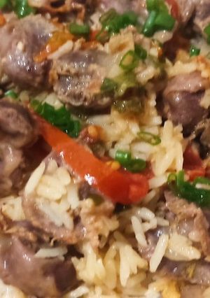 Una foto de Arroz con molleja de pollo