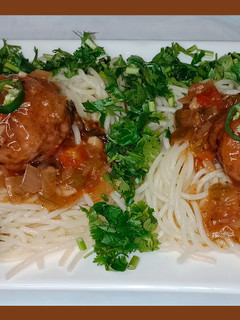 A picture of Slurry meatballs with garlic fried spaghetti.