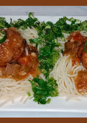 A picture of Slurry meatballs with garlic fried spaghetti.