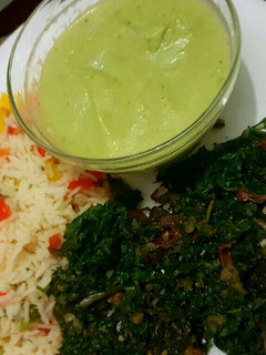 A picture of Vegetable rice Served with spinach and brocolli soup.