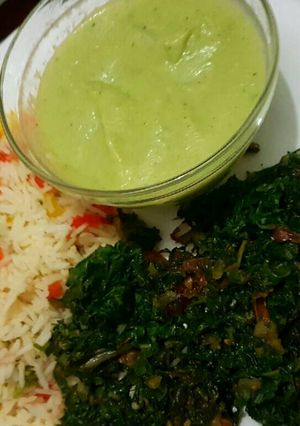 A picture of Vegetable rice Served with spinach and brocolli soup.