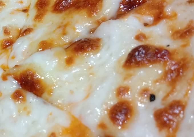 Simple Cheese Pizza Recipe by Neeru jain - Cookpad