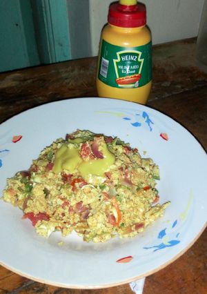 A picture of Spanish omelet with mustard.