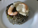 Arroz negro con gambas, pota y salsa alioli