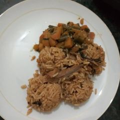 A picture of Grandmas jollof rice with dry fish.