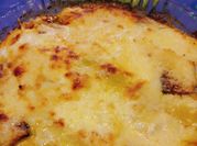 Una foto de zucchini gratinado