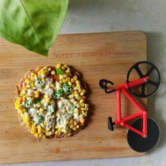 Oats and wheat flour pizza crust on tawa A picture of Oats and wheat flour pizza crust on tawa.