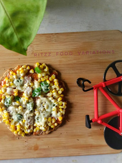 A picture of Oats and wheat flour pizza crust on tawa.