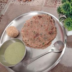 A picture of Rajgira paratha with farali coconut coriander chutney and rajgira laddu.