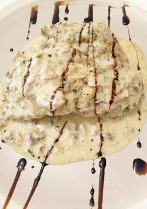 A picture of Chicken Mushroom in creamy sauce.