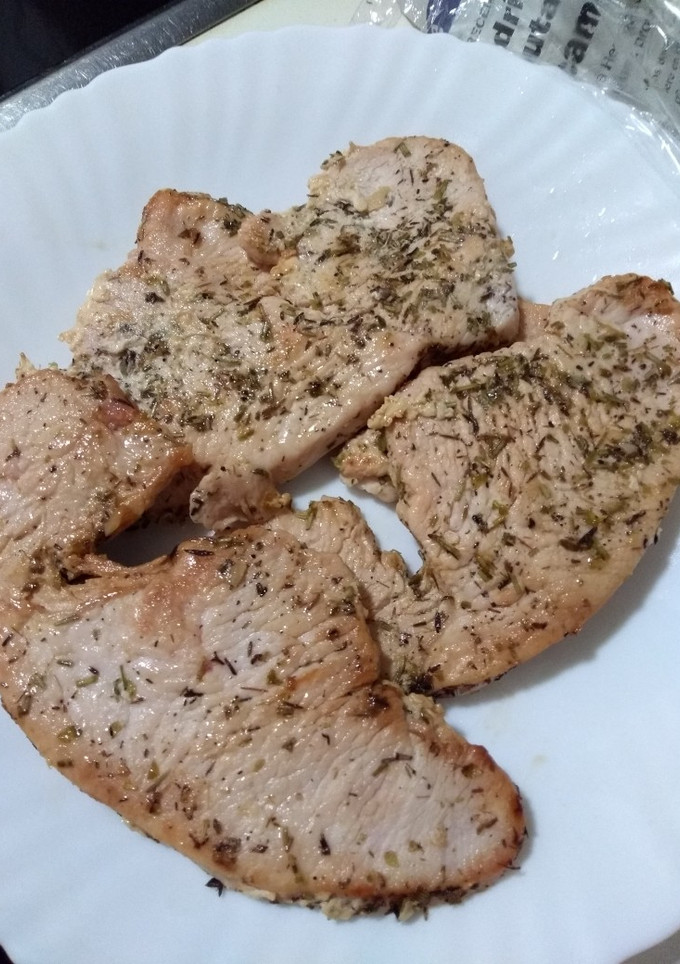 Una foto de Filetes de pavo al ajillo