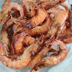 A picture of Grilled shrimp with lemon butter garlic sauce.
